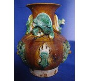 A Rare Tang Sancai Glazed Qilong Vase