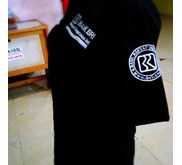 Baju Bengkel BRI Hitam Polos model Trans TV Corp.