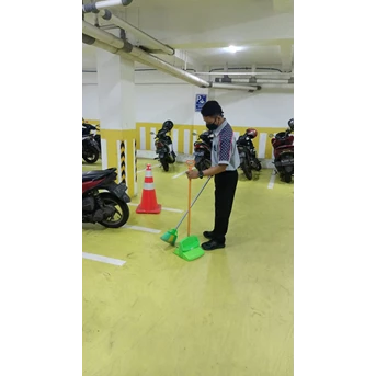 office boy/girl sweeping area parkiran mobile dan motor 13 04 2022