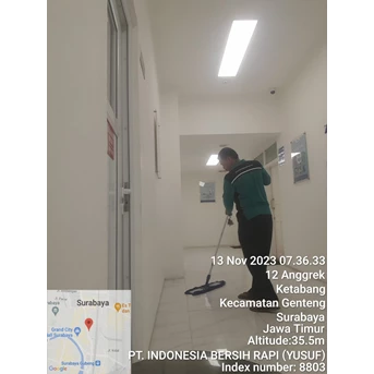 office boy/girl sweeping lorong koridor di klinik surabaya 15/11/2023